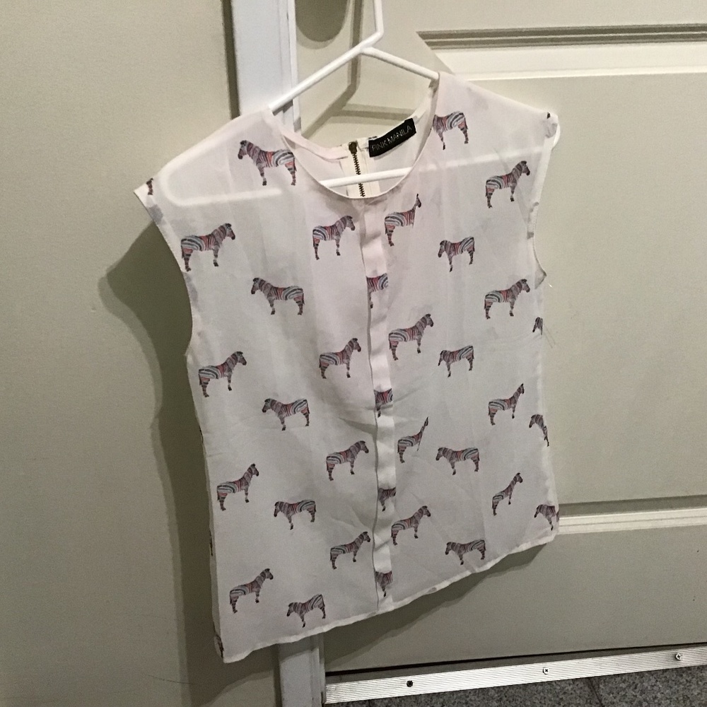 Petite white blouse with  animal  print